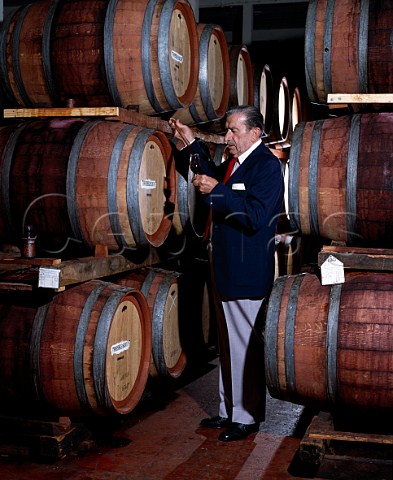 Max Schubert died 1994 takes a sample of Grange Hermitage from barrel Penfolds Magill Winery Adelaide South Australia   