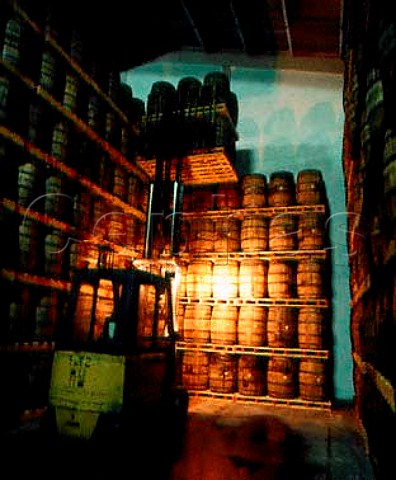 Using forklift to stack barrels of whiskey for   their 7 year maturation period They are stored   vertically six to a pallet for ease of moving   Midleton Distillery County Cork Eire