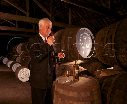 Frank McHardy Master Distiller with samples of whiskey taken from cask  a glass of 10year old malt from bottle is used to ensure consistency of the final blend  Old Bushmills Distillery Bushmills CoAntrim Northern Ireland