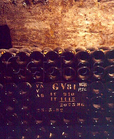 Magnums of Champagne maturing surlattes in the   cellars of Bollinger Ay Marne France