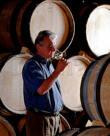 Olivier Leflaive checking on the progress of his   wines ageing in new oak barrels in his chai   PulignyMontrachet Cte dOr France
