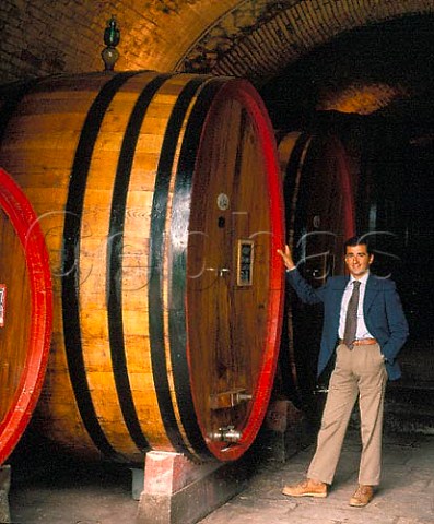 Giovanni Manetti by a botte in the cellars of   Fontodi Panzano in Chianti Tuscany Italy