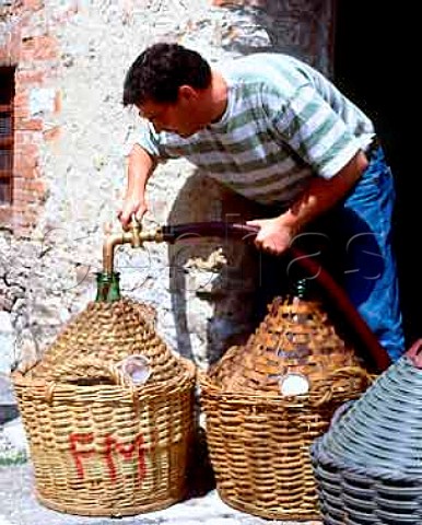 Filling demijohns with wine in the hamlet of Ama   near Lecchi Tuscany Italy  Chianti Classico