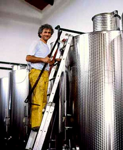 Roberto Voerzio preparing to hand plunge the   grapeskin cap on a tank of fermenting Nebbiolo   La Morra Piemonte Italy   Barolo