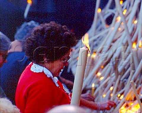 Pilgrims lighting candles by the Chapel of the Apparitions at Fatima In 1917 the Virgin Mary was said to have made six appearances to three peasant girls culminating on 13 October in the socalled Miracle of the Sun The chapel is built on the site of the oak tree in which she was said to have appeared Fatima Portugal