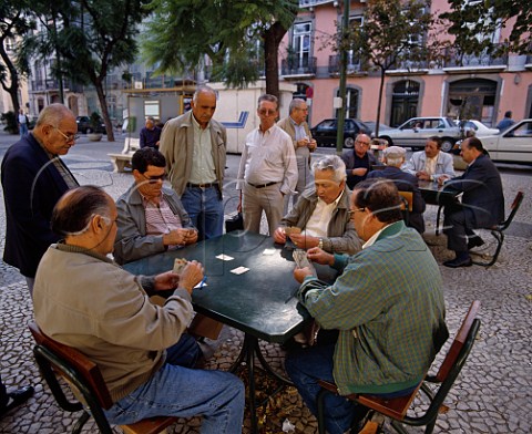 Men playing cards in the Largo do Carmo Lisbon    Portugal