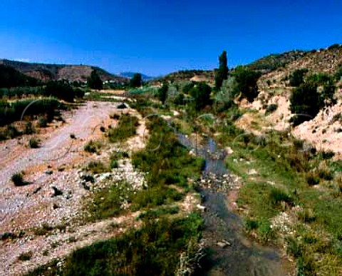 The Rio Vero winds through the plateau near the   village of Huerta de Vero Aragon Spain  DO   Somontano