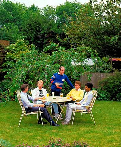 Men relaxing in garden