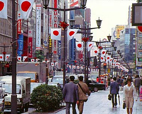 Japanese flags on display on Chuo Dori Avenue in the   Ginza district of Tokyo  Japan
