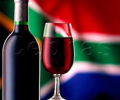 Bottle and glass of red wine with the   South African flag