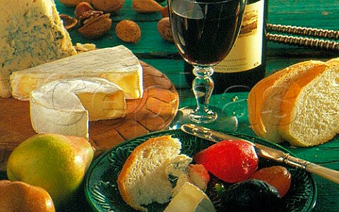 South Africa Glass and bottle of red wine with bread cheese and glace fruits