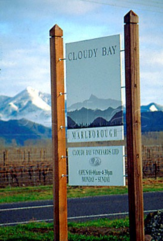 Cloudy Bay sign with the snow covered   peaks of the Richmond Range beyond   Marlborough New Zealand