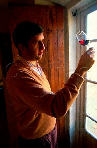 Rose Ferrer of Bodega Franja Roja Jose   Ferrer examines a glass of his Riserva   1984 Binissalem Majorca