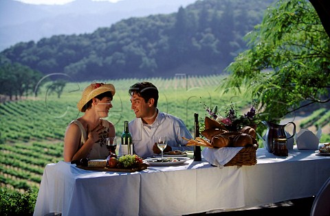 Couple dining on the terrace of Joseph Phelps  Winery St Helena Napa Valley California