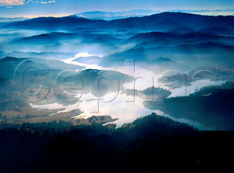 Earlymorning fog drifting over Santa Margarita Lake   in the Santa Lucia Range   San Luis Obispo Co California