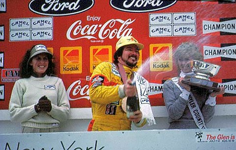 Clay Young spraying sparkling wine after   the Watkins Glen International motor   race New York USA