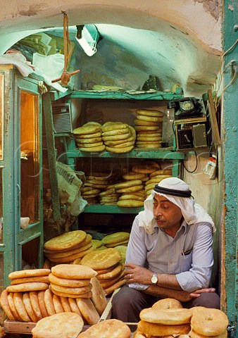 Baker in the bazaar Jerusalem Israel