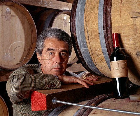 Carlo de Corato and bottle of his Il Falcone in the   cellars of Rivera Andria Puglia Italy Castel del   Monte