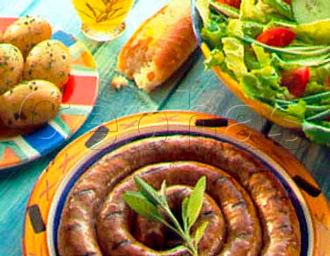 Cumberland sausage potatoes French bread and   salad