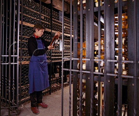 Sandrine Garbay former Matre de Chai examines a magnum   of 1967 in the vintage bottle cellar of Chteau   dYquem Sauternes Gironde France