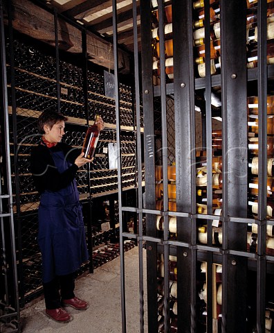 Sandrine Garbay former Matre de Chai examines a magnum of 1967 in the vintage bottle cellar of Chteau dYquem Sauternes Gironde France