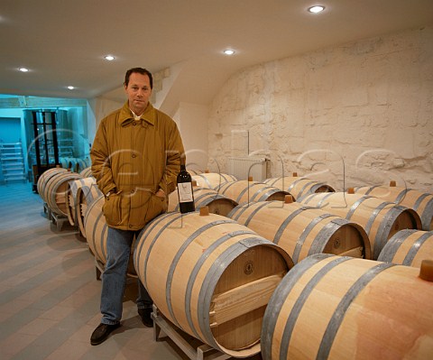 JeanLuc Thunevin with new oak barriques holding   wine undergoing the malolactic fermentation  Chteau   de Valandraud Stmilion Gironde France