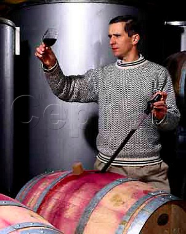 David Cowderoy winemaker checking sample of wine from barrel circa 1999