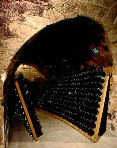 Bottles of Champagne in pupitres in the cellars of   Mot et Chandon pernay Marne France