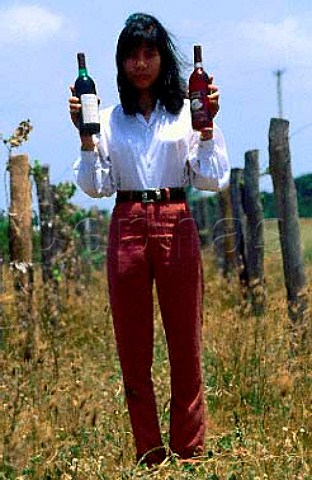 Woman with bottles of wine in vineyard   of Allied Domecq north of Saigon   Vietnam