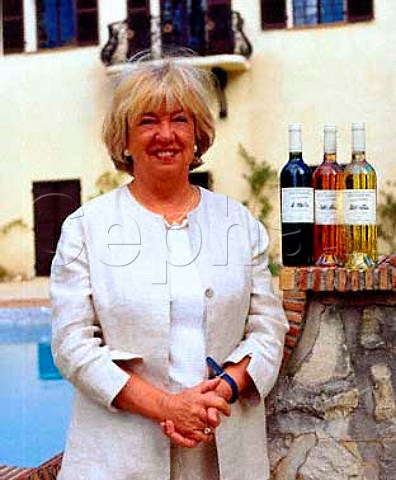 Betty Ann Cundall with bottles of red ros and   white wine from her prestige range   Chteau des Chaberts Garoult Var France     Coteaux Varois