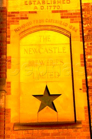 Engraving on the wall of Scottish and   Newcastle brewery producers of Newcastle   Brown Ale Newcastle England