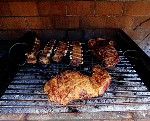 Steaks and ribs on the Asado barbeque Argentina