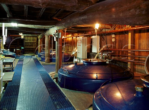 Traditional fermentation and storage tanks at Sawanoi Sake Brewery Sawai Tokyo Japan