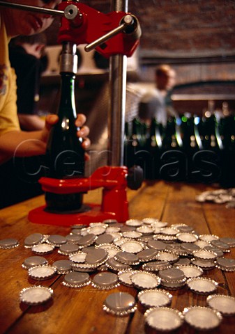 Closing sparkling wine bottles with   crown caps for the first fermentation  Ambeloui Wine Cellar Hout Bay   Constantia South Africa