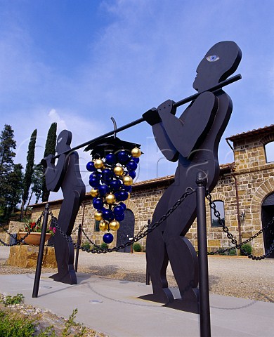 Sculpture depicting the Israelite spies carrying the   huge bunch of grapes from the Promised Land which is   the logo of Il Molino di Grace Panzano in Chianti   Tuscany Italy  Chianti Classico
