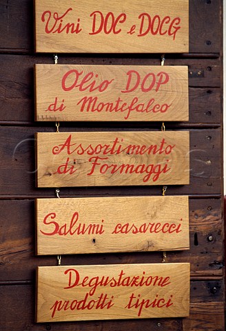 Sign outside a bar advertising tasting   of wine olive oil cheese and salami   Montefalco Umbria Italy