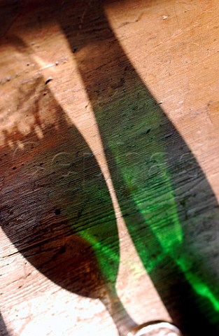 Shadow of beer bottle and glass