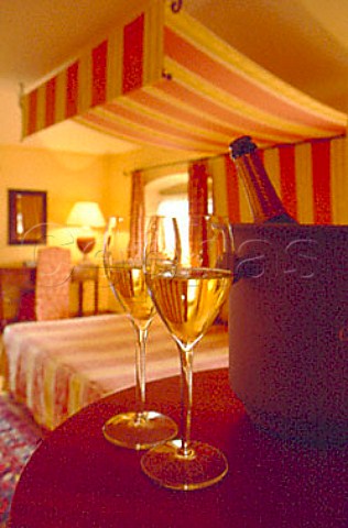 Two glasses of sparkling wine in bedroom   of Hotel Albereta Erbusco Lombardy   Italy   Franciacorta