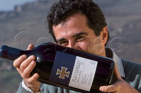 Giovanni Manetti of Fontodi with bottle of his Flaccianello Panzano in Chianti Tuscany Italy    Chianti Classico