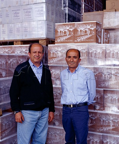 Giuseppe left and Franco Argiolas with cases of   Argiolas wine ready for despatch   Serdiana Sardinia Italy