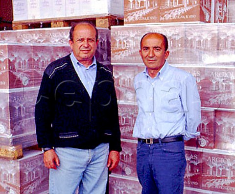 Giuseppe left and Franco Argiolas with cases of   Argiolas wine ready for despatch   Serdiana Sardinia Italy