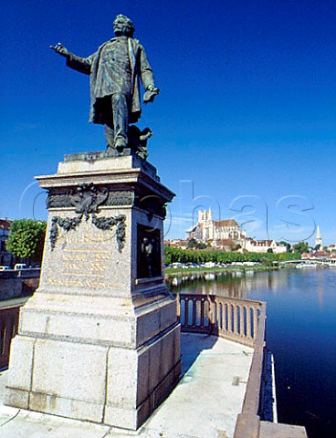 Statue of Paul Bert with Cathdrale StEtienne and   the Yonne river behind Auxerre    Yonne France  Bourgogne