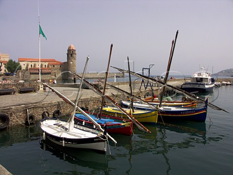 Brightly painted traditional fishing boats in   Collioure harbour   PyrnesOrientales France