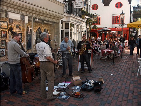 Jazz band busking in front of openair restaurants  and cafs Brighton East Sussex England