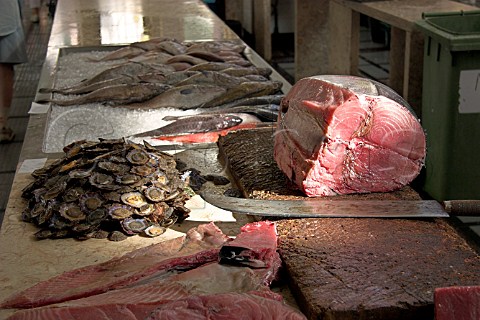Tuna and Lapas on a chopping block in the Mercado  dos Lavradores Funchal Madeira Portugal