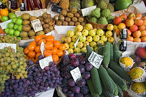 Display of fruit and vegetables on a market stall at   the Mercado dos Lavradores Funchal Madeira   Portugal
