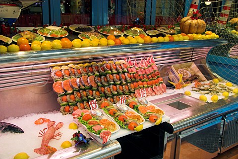 Seafood brochettes on display outside a small caf   on Rue de la Huchette Paris France