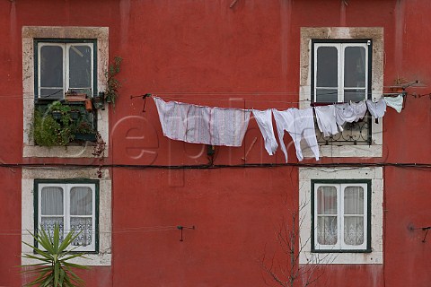 Laundry hanging from windows in Alfama Old Lisbon   Portugal