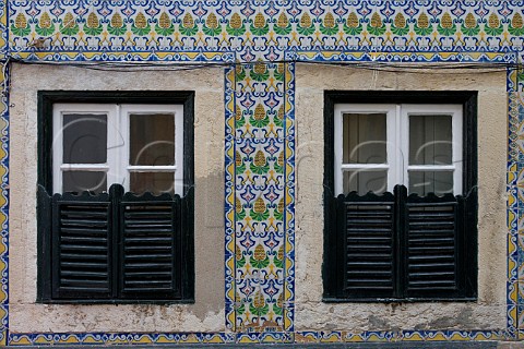 Traditional azulejos tiles surrounding windows   Alfama Old Lisbon Portugal