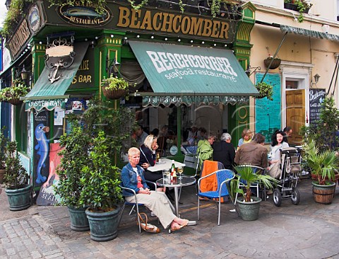 People drinking wine outside the Beachcomber seafood  restaurant Greenwich London England